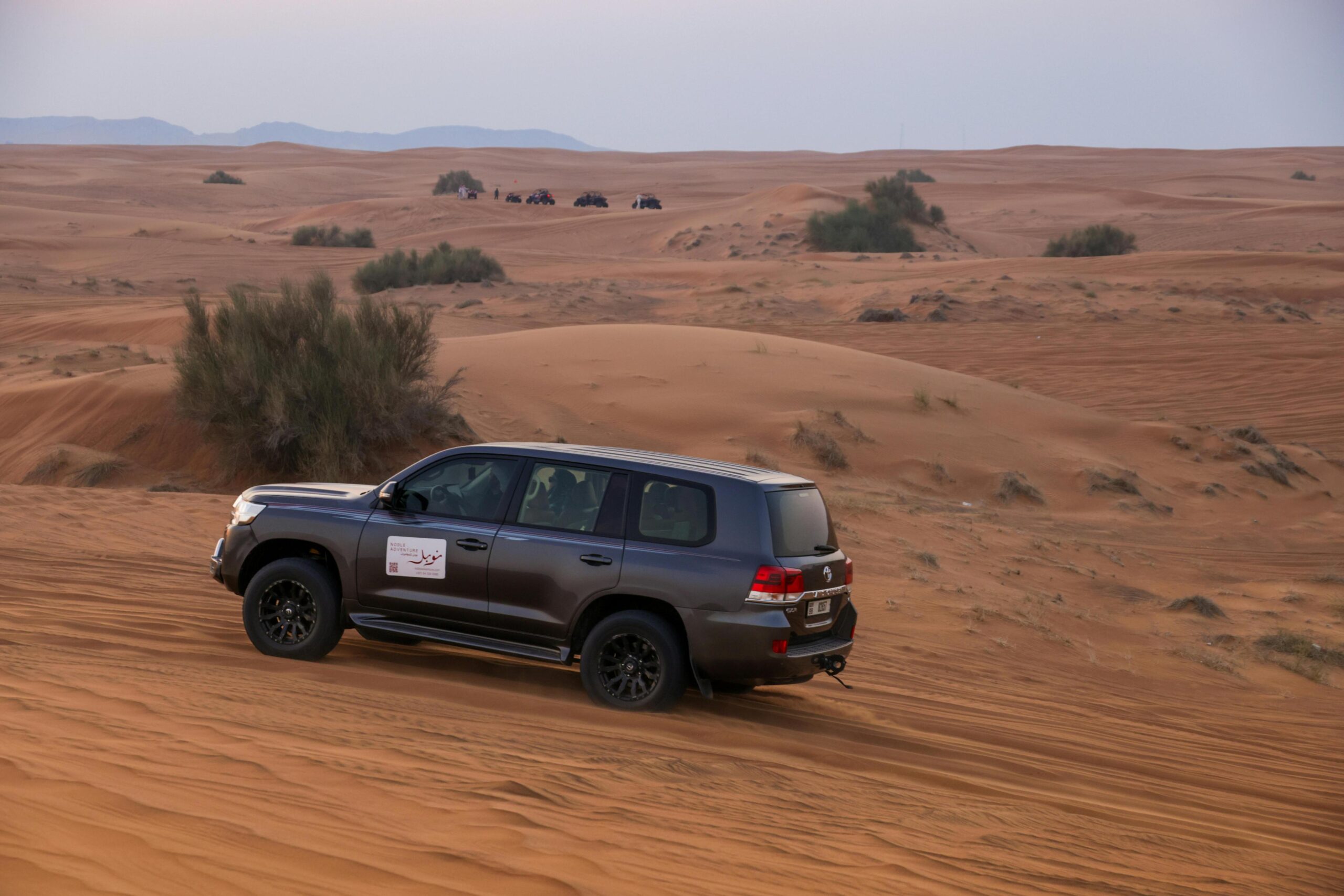 4WD Toyota driving off-road through the Sahara desert Morocco